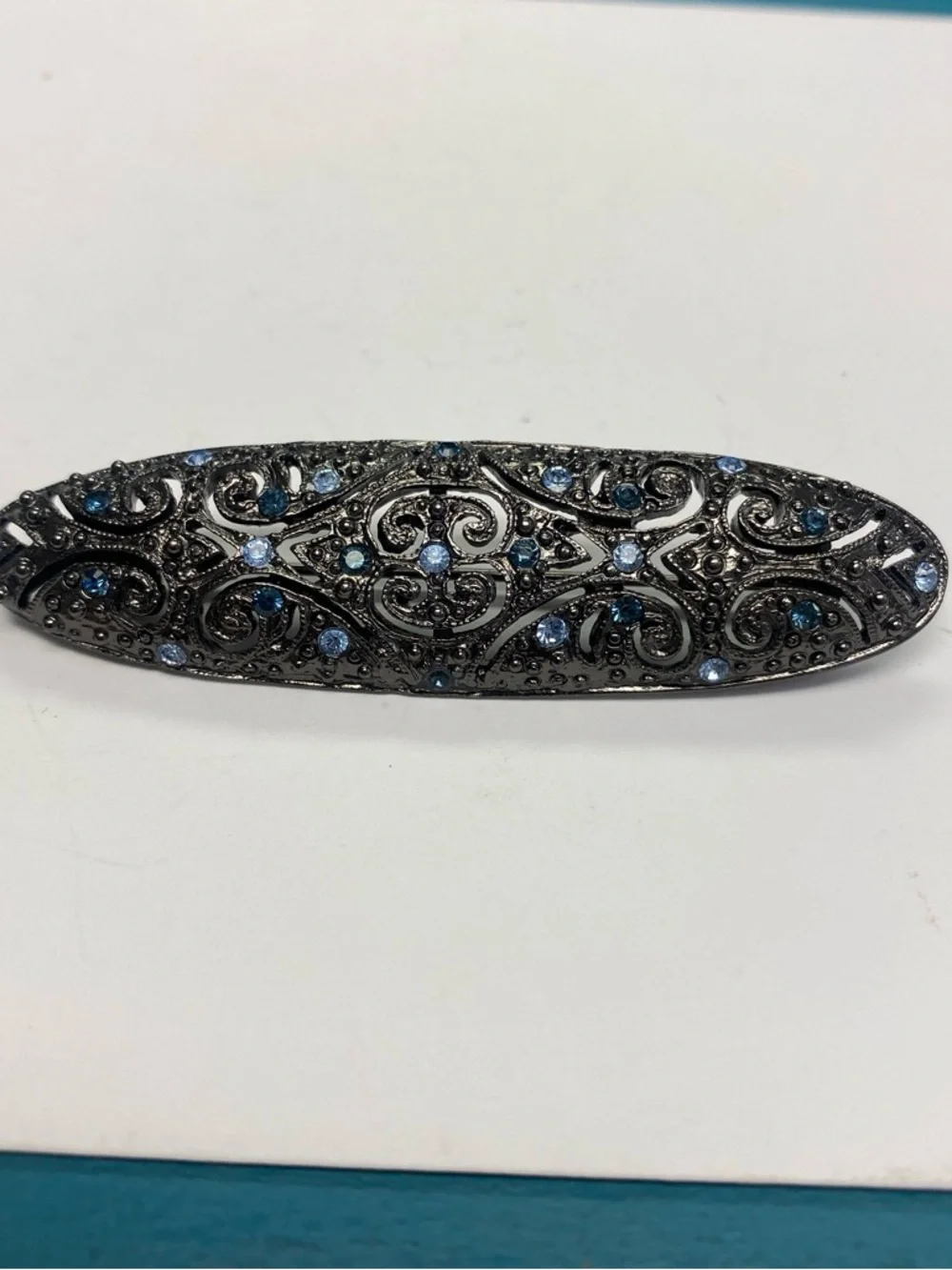 Decorative Gunmetal Brooch  with Blue Rhinestones